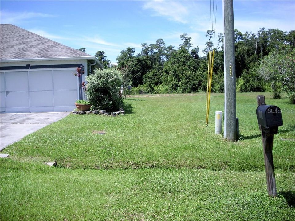 Left side of photo is the neighbor's house on the front flag lot.