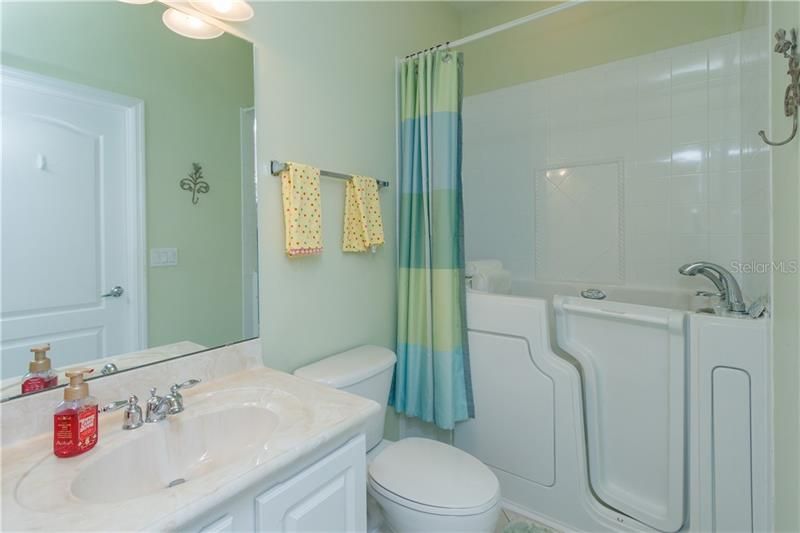 Guest Bathroom with Walk In Jacuzzi Bath/Shower