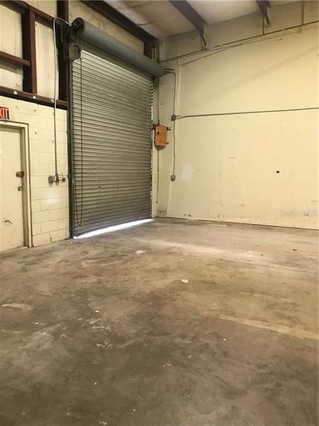 Roll up door in warehouse area.  Has side entry