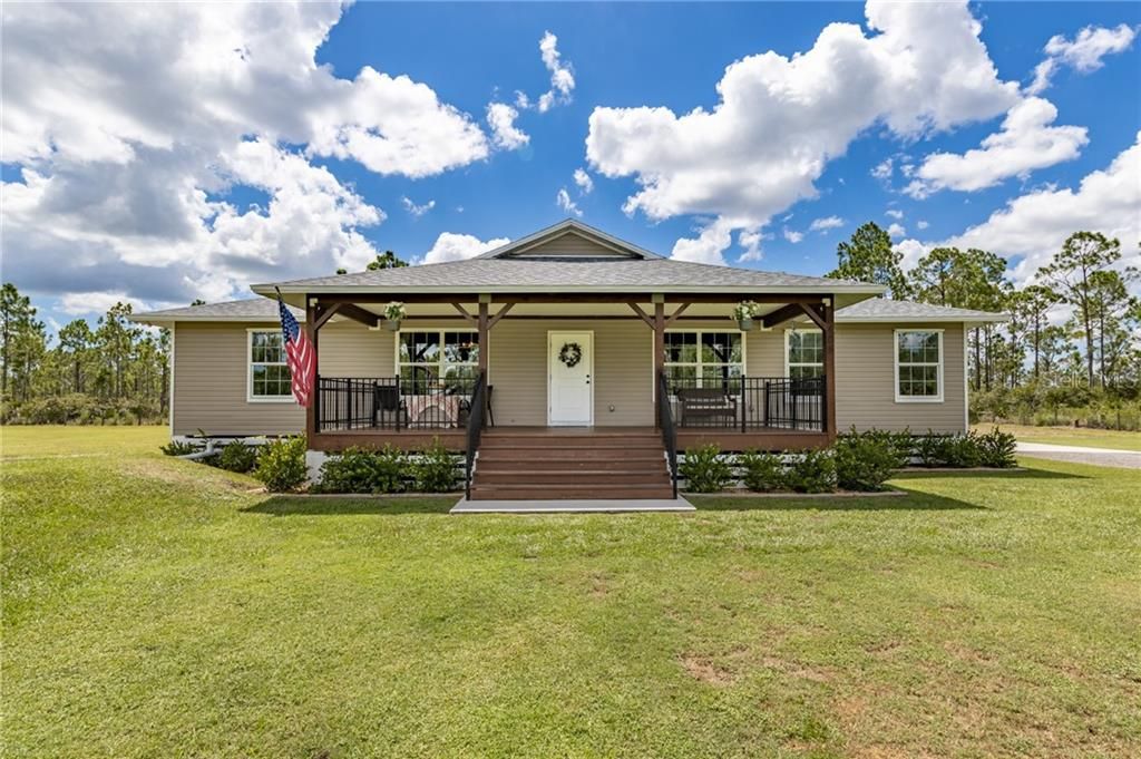 Old Florida Cracker style home on 2.5 acres of improved land. Fully fenced with gated entrance.