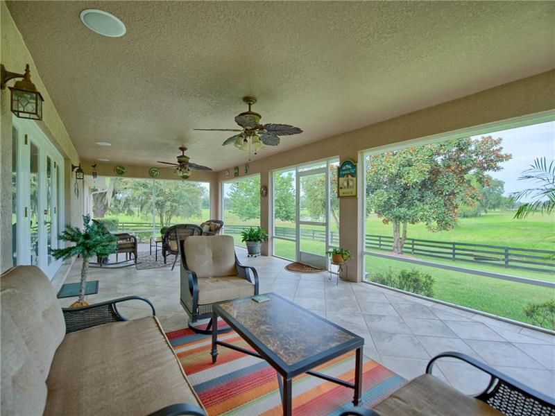 SCREENED LANAI WITH CEILING FANS