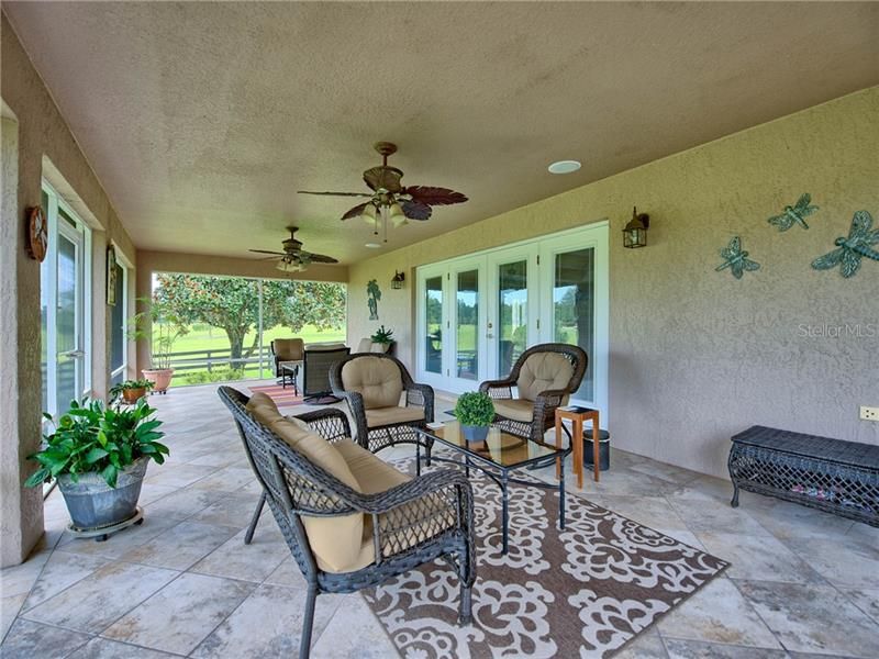 SCREENED LANAI WITH CEILING FANS