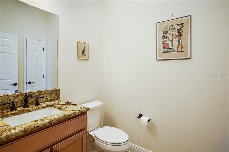 1/2 bathroom with granite countertop