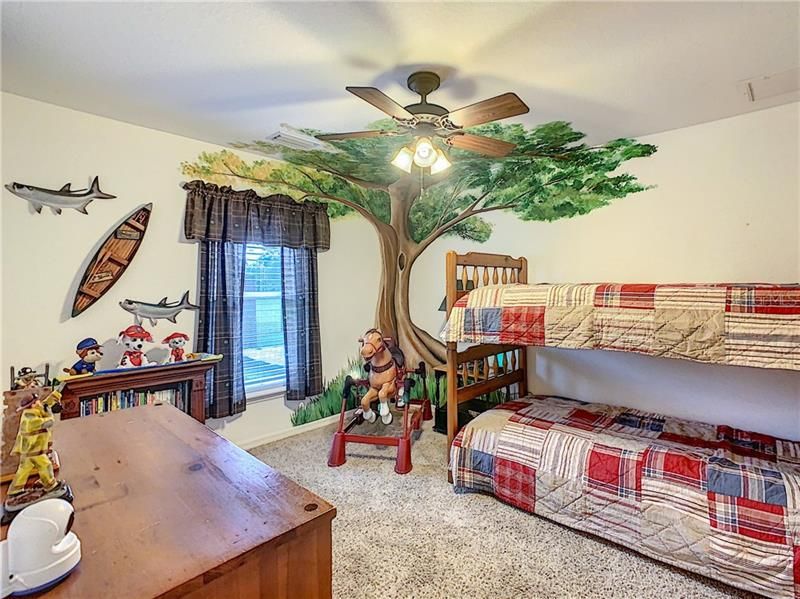 Bedroom #2 is 11' x 12'.  You will enjoy the detail in this hand painted mural.  It will bring back the kid in you and you will want to discover what nature has in store for you in the real back yard trees.