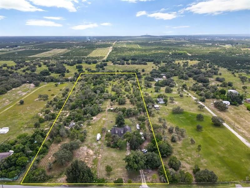 4 parcels make up this almost 10 acre parcel of land with modern contemporary home located only 5 minutes from US Hwy 27 and Cypresss Gardens Blvd.