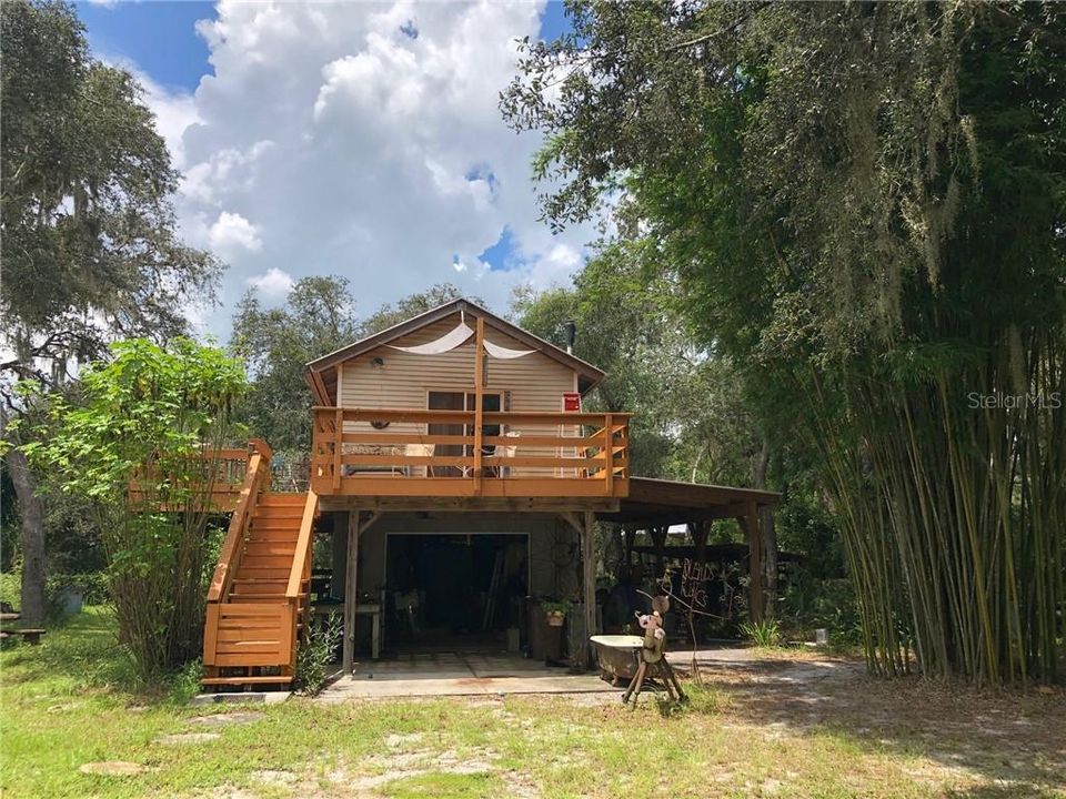 Front view of 2story building, 1 car garage and guesthouse