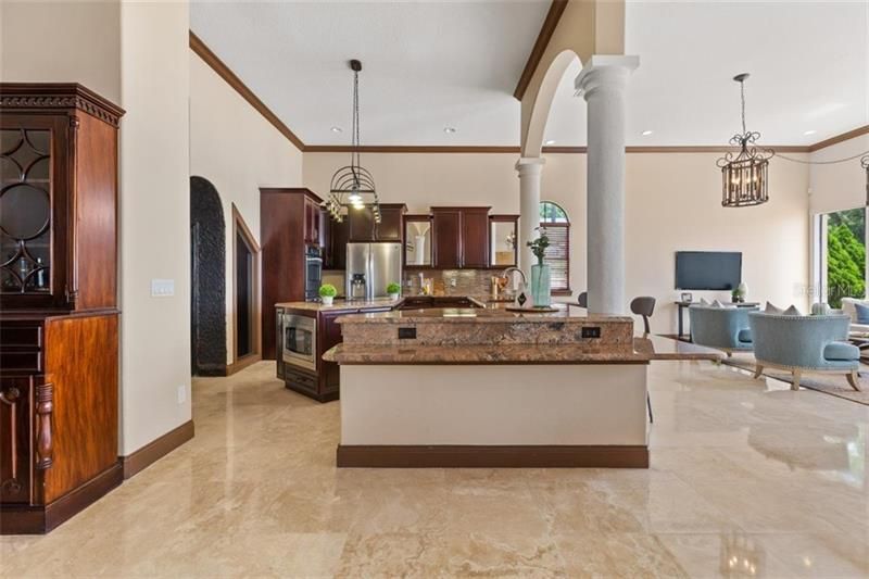 On a grand scale - kitchen and family room. Always with ample light and lake views.