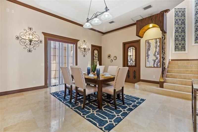 The dining area with ample space for a cozy dinner or a large, lively gathering.