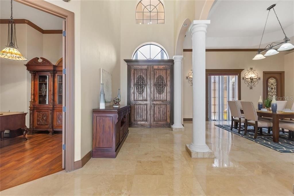 Enter your reign of beauty and tranquility through the high, solid wood, double wing door, reminiscent of the Old World charm. Your study located to the left.