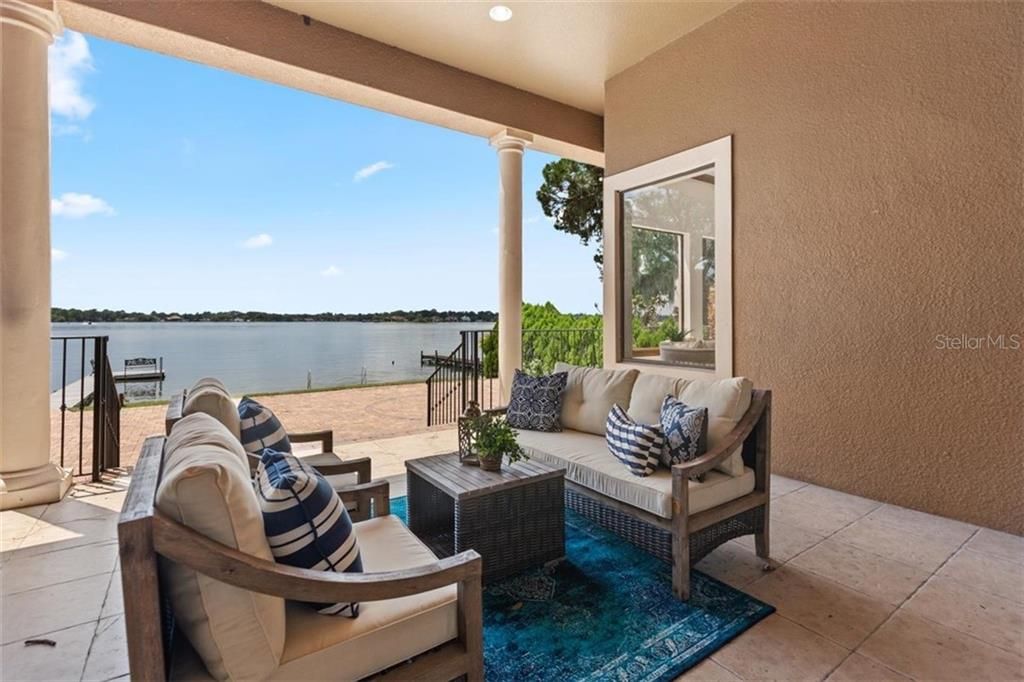 Take just a few steps to the edge of the water from the covered patio. This setting redefines outdoor living.