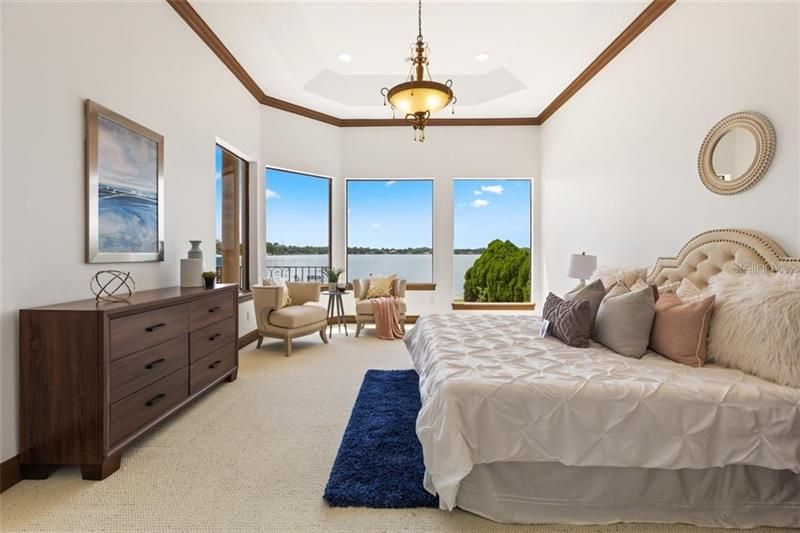 The serene, first floor master bedroom with a dreamy view.