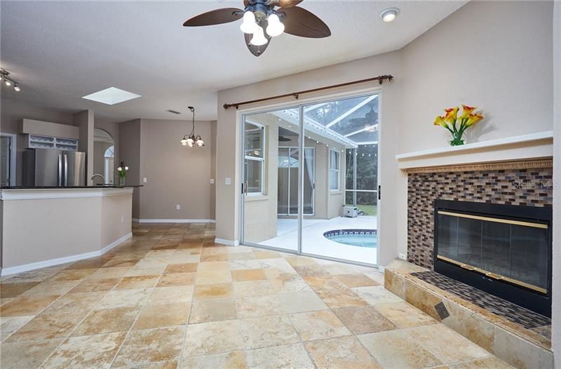 Spacious family room opens to the pool area and kitchen!