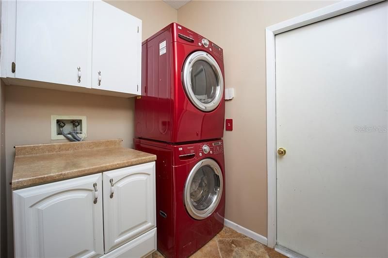 Laundry room with cabinets and counter space!