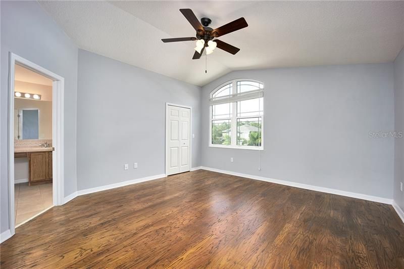 Master bedroom with upgraded wood floors!