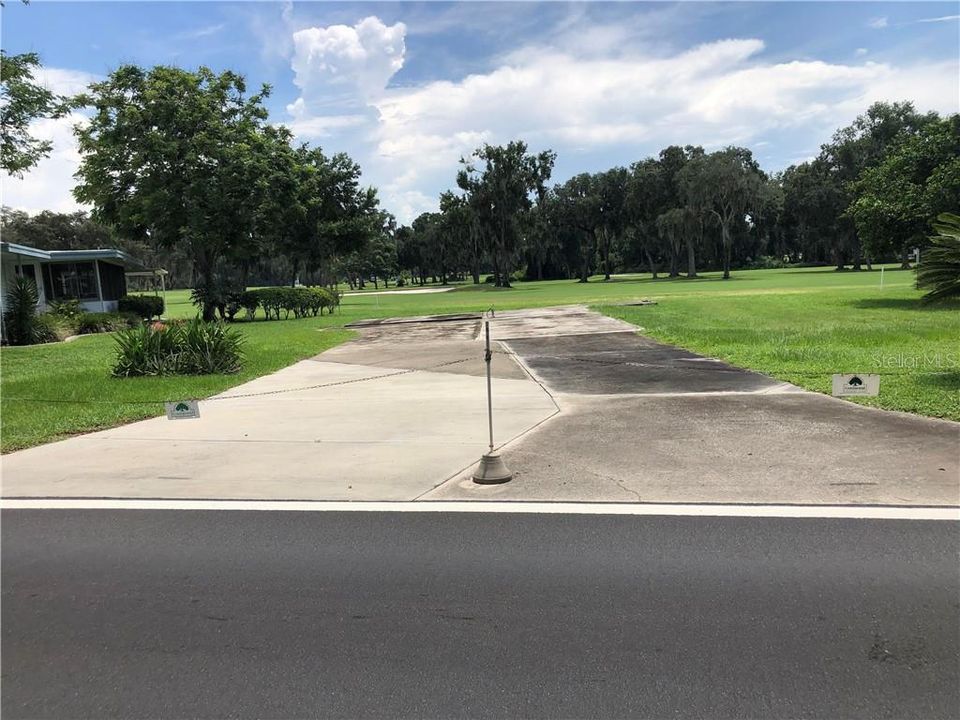 VIEW FROM BIG OAK BLVD.  CONCRETE DRIVE ENTRANCE TO PROPERTY