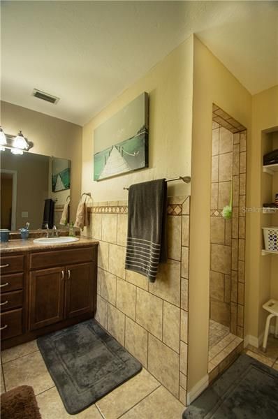 Master bath with walk in shower and dual sinks