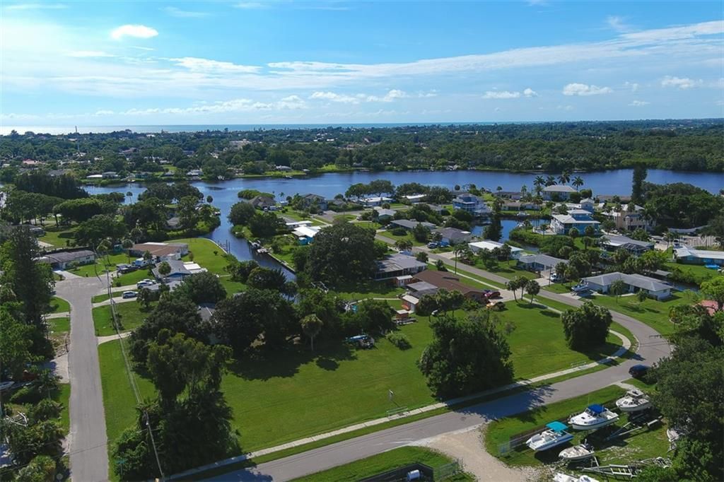 The salt water canal connects to Dona Bay (pictured) which connects to Gulf of Mexico. Two corner lots are adjacent and together have road frontage on three sides as pictured. Sidewalk on two sides (Lot 6 to North has sidewalk).