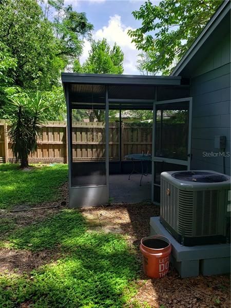 Back Yard with A/C and Screened In Patio