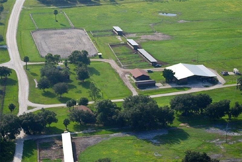 Equestrian complex with riding arena, stables, tack room, round pen, wash racks, and more.  There are miles & miles of trails to ride within the 3600 community-owned acres.