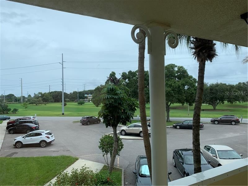 This is the golf course view right outside your door.  Your assigned parking space is the champagne colored car in the center of the photo.  There are guest parking spaces and guest parking is allowed out on the street.