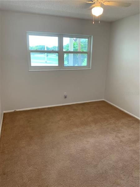 Guest bedroom.  You have a direct view of the golf course from this bedroom.