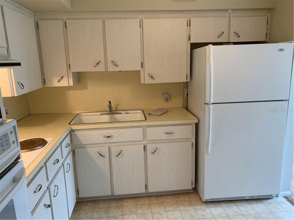 Closer view of the kitchen.  Refrigerator, stove and microwave oven are included.