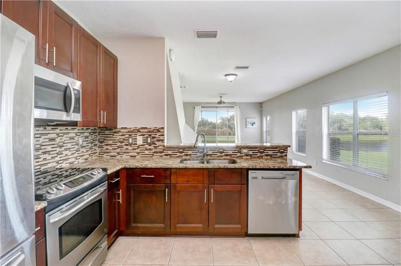 Gourmet Kitchen with high end finishes and water views all around!