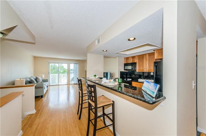 Second level with beautiful water views from the spacious living room, complete with wood burning fireplace. Updated kitchen offers entertaining from living room and then into formal dining room on the other side.