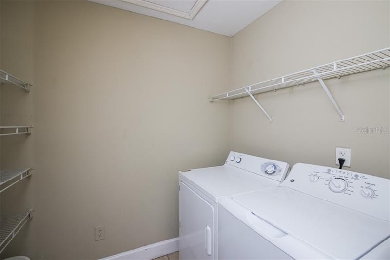 Inside laundry room and extra storage.