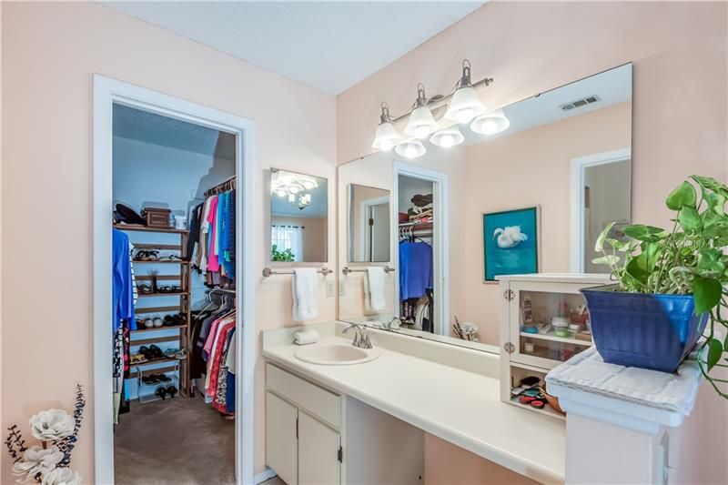 Master bathroom area has a walk in closet and make up area