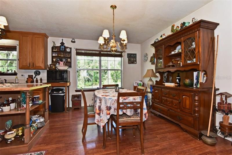 Dining area overlooks the backyard and opens to the kitchen!