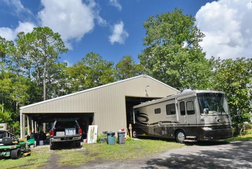 Huge workshop/garage - 35'x50' and lean to is 18x50 - garage doors on both ends!  Includes a bathroom & 2 rooms for storage, office, tack room, etc!