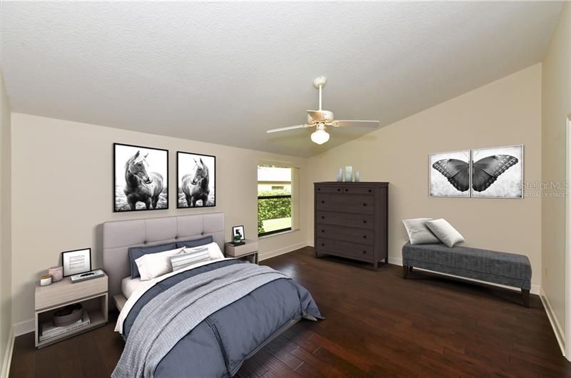 Virtually Staged master bedroom with walk-in closets and en suite bath