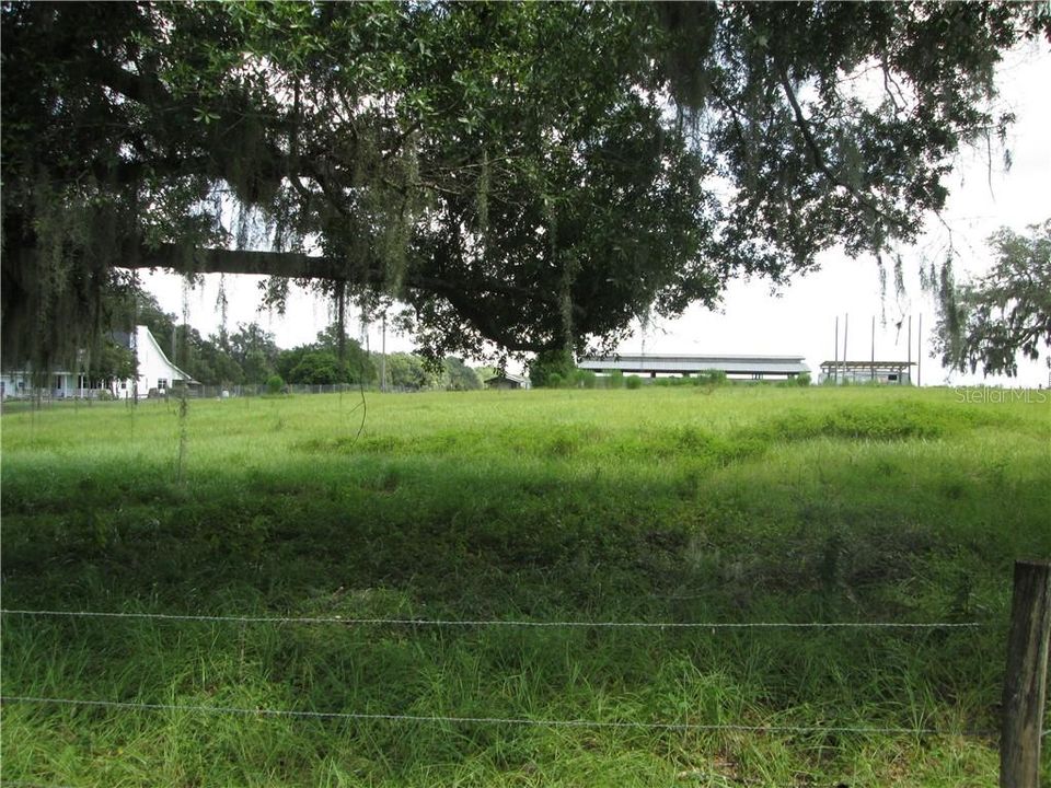 View from the paved road... back pasture all mowed down...behind the barn. Can't see from the road