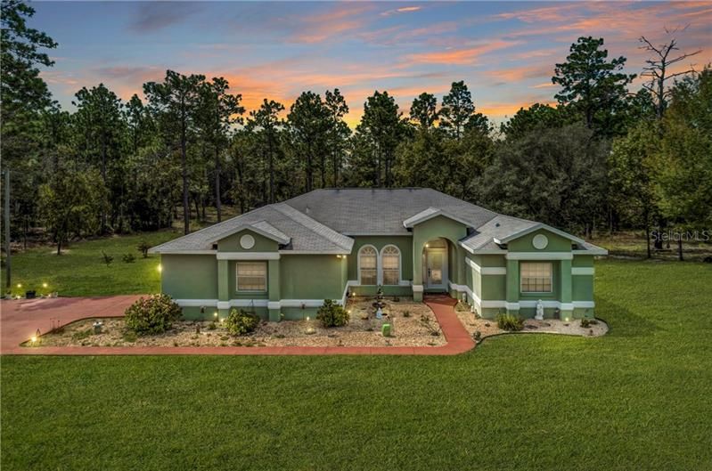 front view of the home sits in 1.98 acres.