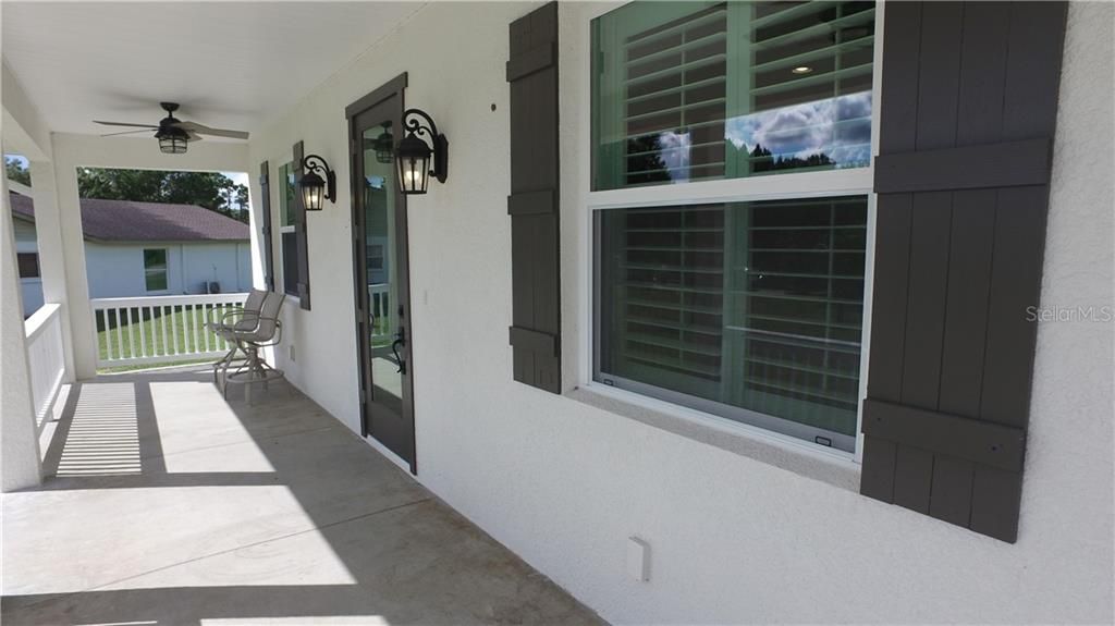 Plenty of space on the front porch to enjoy your morning coffee or relax in the evening.