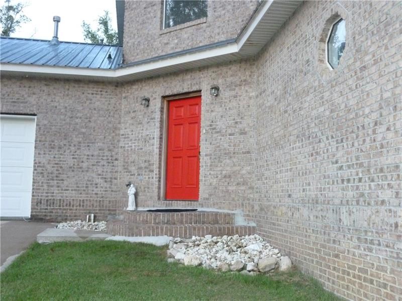 Inviting and handsome Front Entry .. love the solid brick .. let's go in