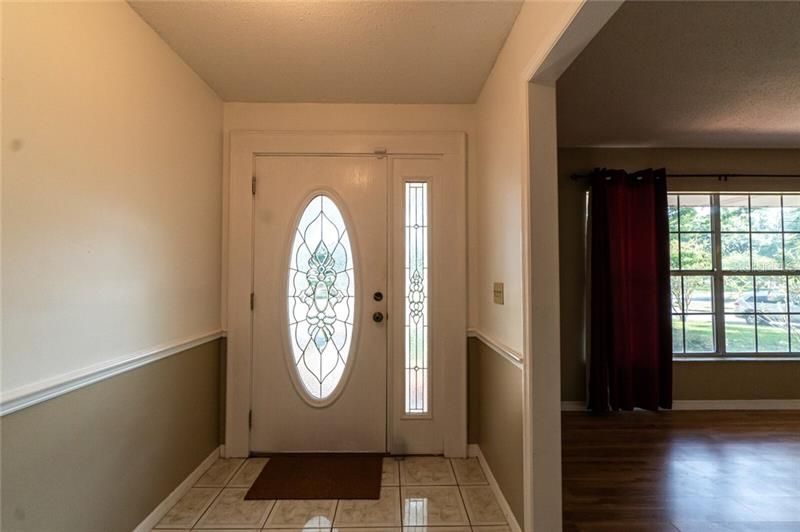 Front entry foyer with beautiful glasss door and huge formal living and dining room combo right off to the right