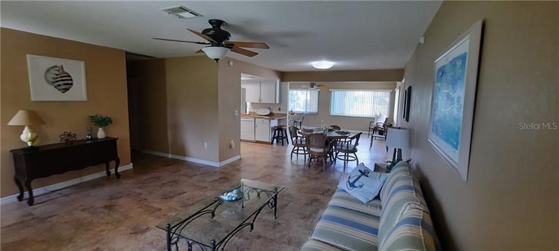 formal living room, dining area kit and family room in the back. New tile thruout except bedrooms have new carpet