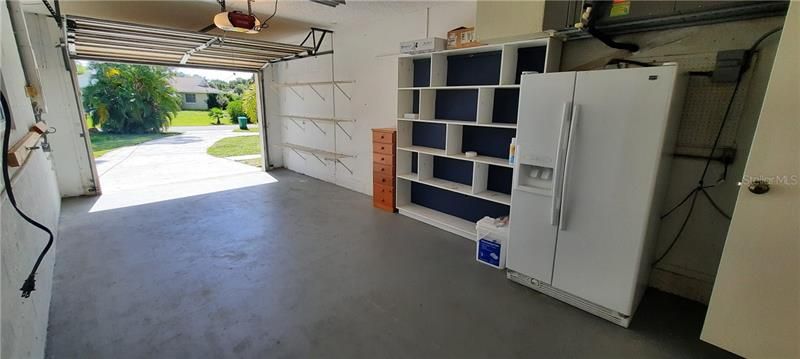 one car garage with door opener and spare frig/freezer for fish/beer with hooked up ice maker