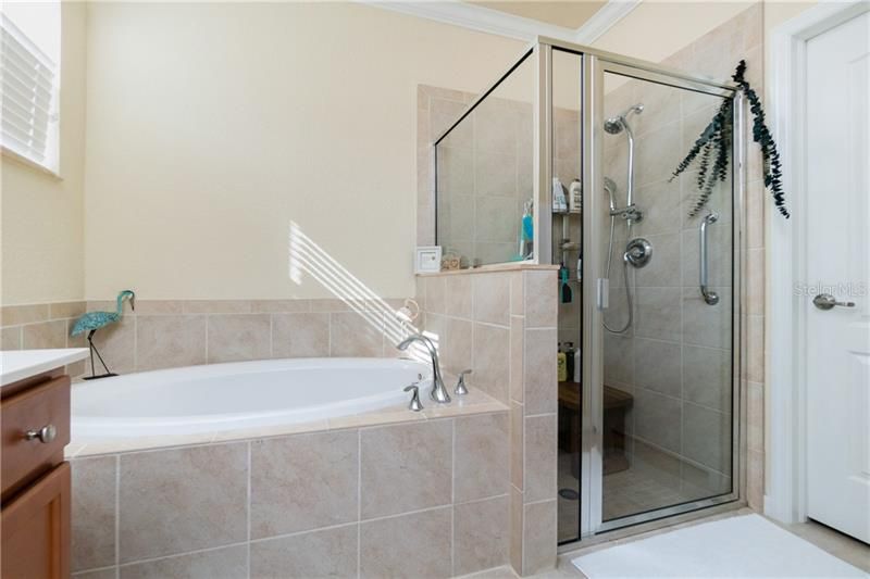 Master has garden tub and walk-in shower.