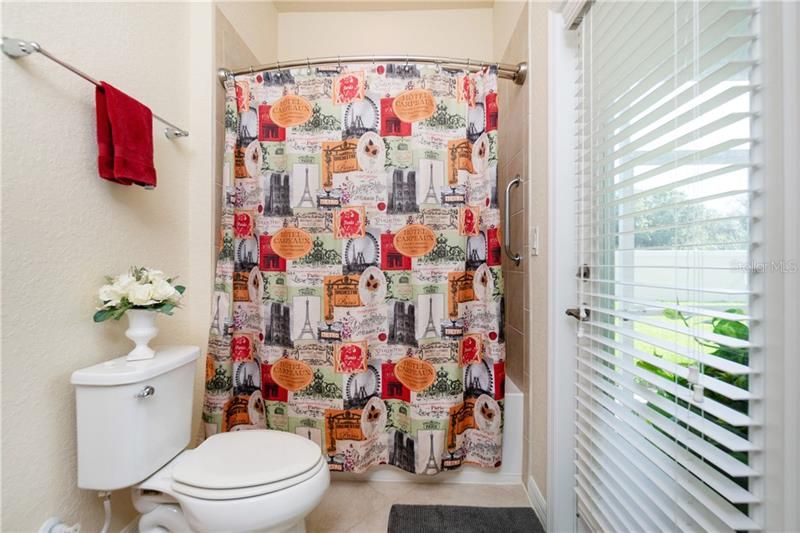 Guest bathroom with door to lanai.