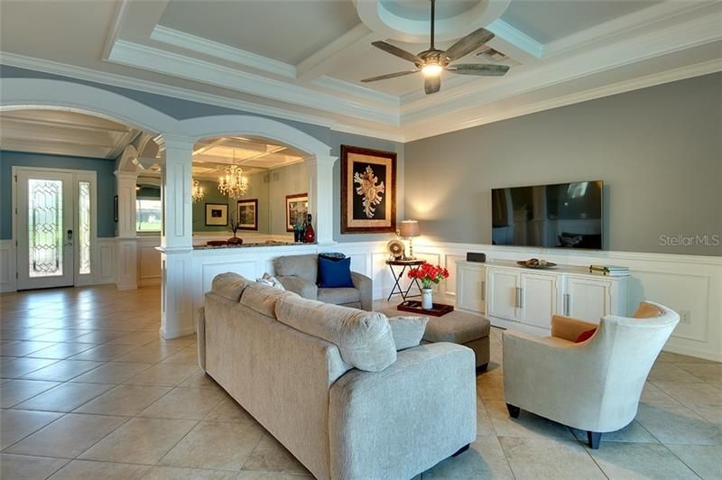 Grand Great Room with amazing crown molding and archways