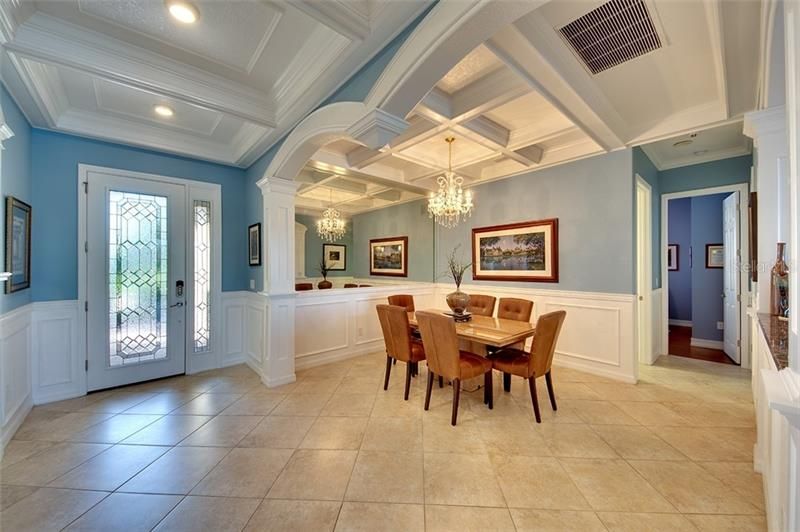 Formal Dining Room adorned with Crown Molding