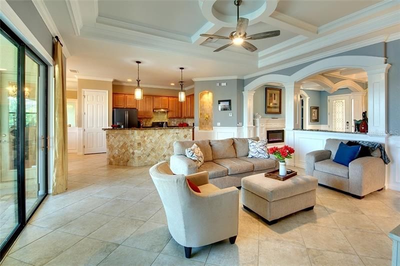 Great Room with amazing Custom Trim flows seamlessly into Gourmet Kitchen