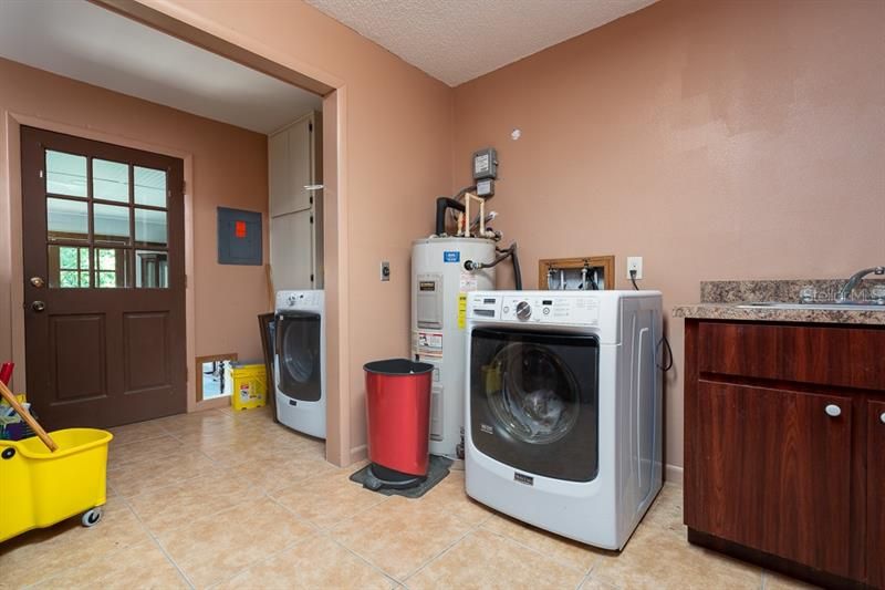 Front loading Maytag appliances stay with your new home. The laundry room is huge!