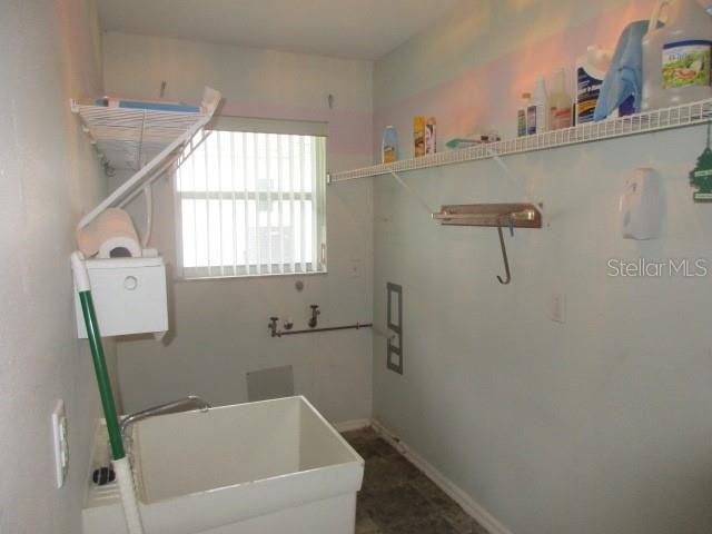 INSIDE LAUNDRY WITH UTILITY SINK