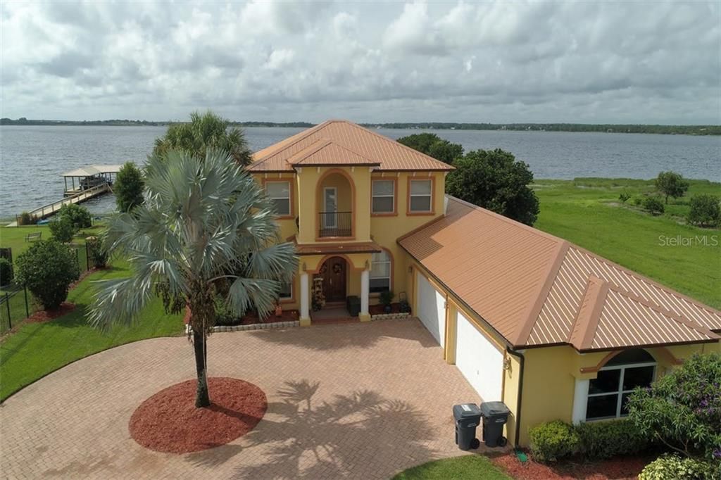 AERIAL VIEW OF HOME AND GARAGE