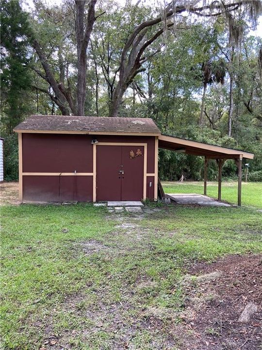 Wood shed with Concrete floor and electric and lights and outlets