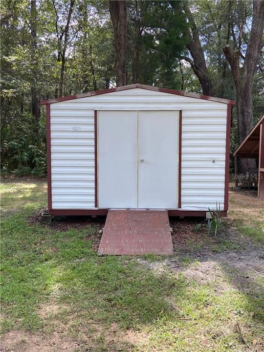 Metal shed with electric ran to it with lights and outlets